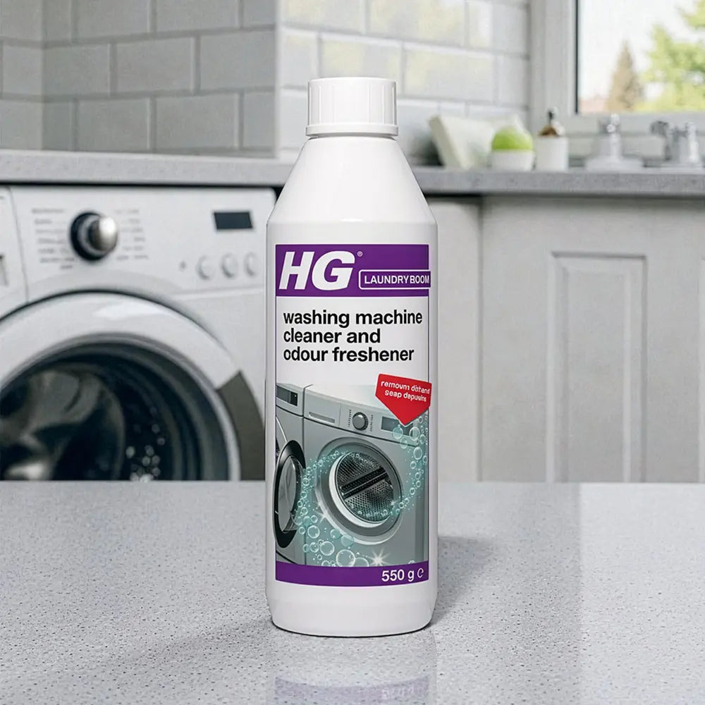 HG Laundry Boom washing machine cleaner and odour freshener 550g bottle displayed on kitchen counter with white washing machine in background