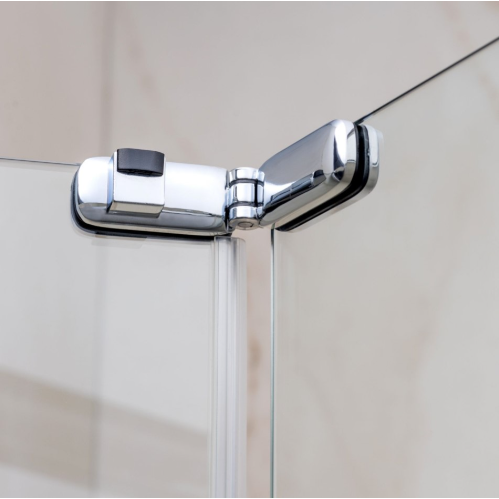 Close-up of a chrome and matt black bifold shower door hinge and frame detail showing polished metal hardware and white frame profile against neutral bathroom tiles