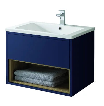 Sapphire blue wall-hung bathroom vanity unit with white ceramic sink, chrome mixer tap, and open shelf storage displaying folded grey towels