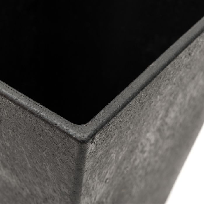 Close-up detail of slate grey concrete garden planter corner showing textured surface and smooth rounded edge of Tierra Verde Sonata 50cm square planter