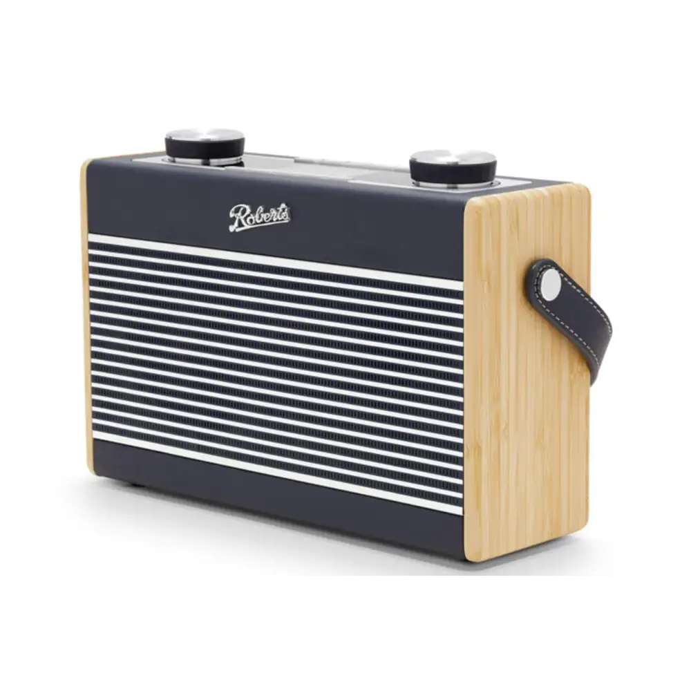Roberts Rambler Max portable DAB+ FM radio with navy blue and cream striped grille, light wood sides, black top panel, dual control knobs, and black leather carry handle