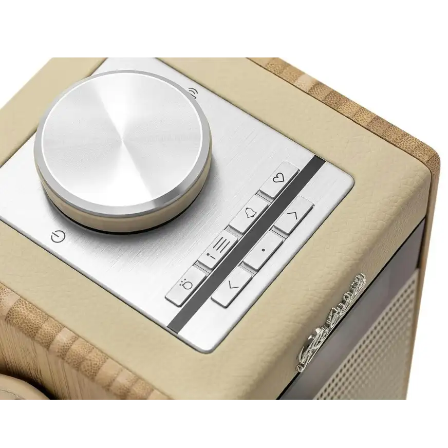 Roberts Rambler Midi DAB+ FM radio in pastel cream with silver control dial and buttons on natural linen fabric exterior, featuring Bluetooth connectivity