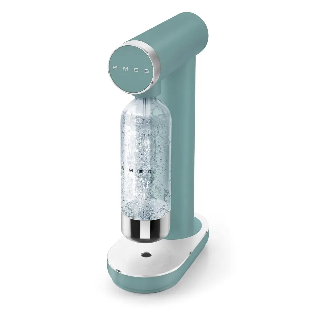 Smeg emerald green sparkling water soda maker with white base, featuring a cylindrical carbonation bottle filled with water and metal accents, modern retro kitchen appliance design