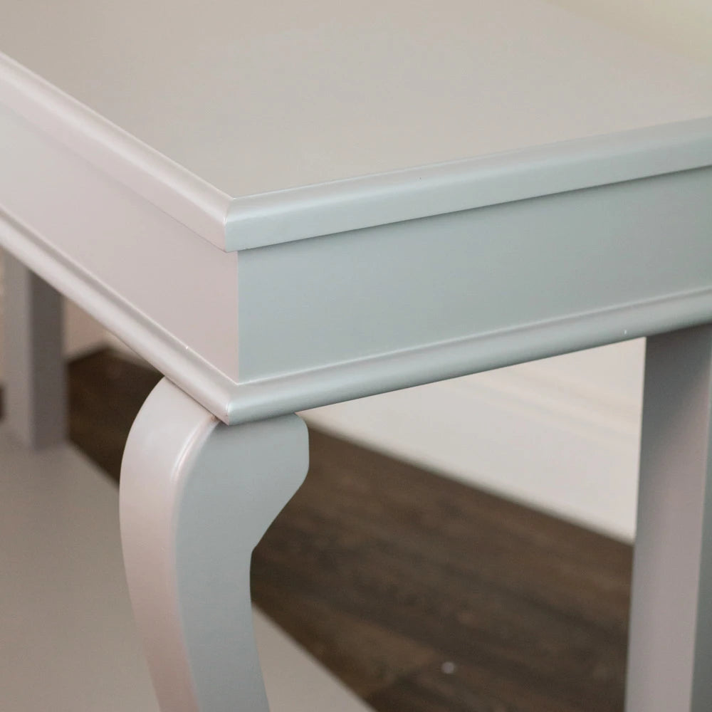 Close-up detail of Tara Lane Scroll Console Table showing white painted finish, curved leg support, and polished top surface against neutral background