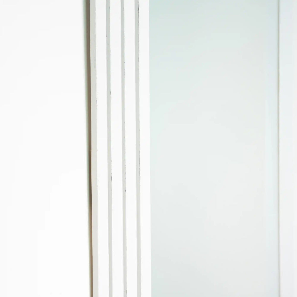 Tara Lane stepped pill shaped dressing mirror with oyster frame, 45cm x 150cm, featuring vertical ribbed details on left side against white background