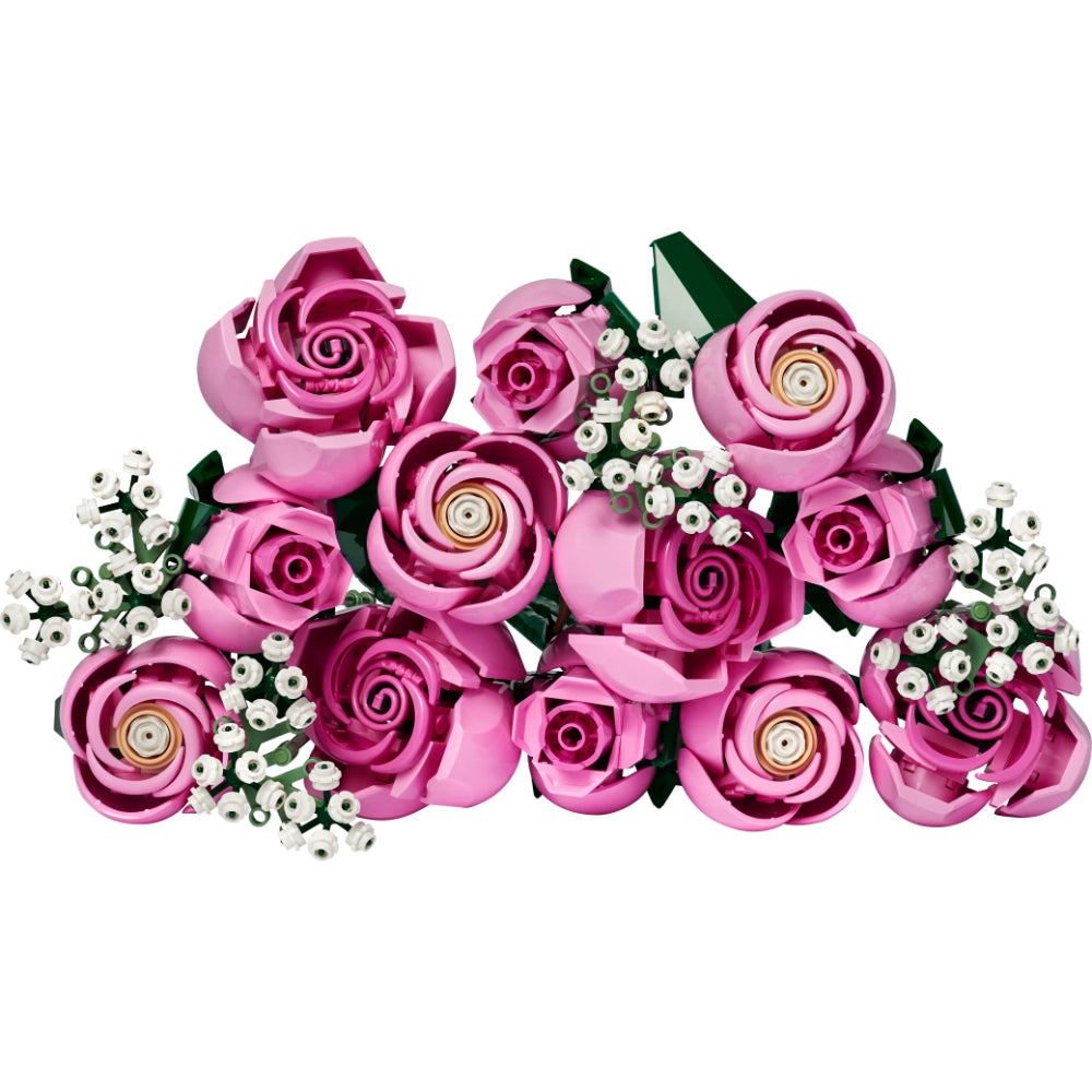 LEGO Bouquet of Pink Roses 10374 featuring interlocking pink rose flowers with gold centers, white baby's breath filler flowers, and green leaves arranged in a decorative floral display