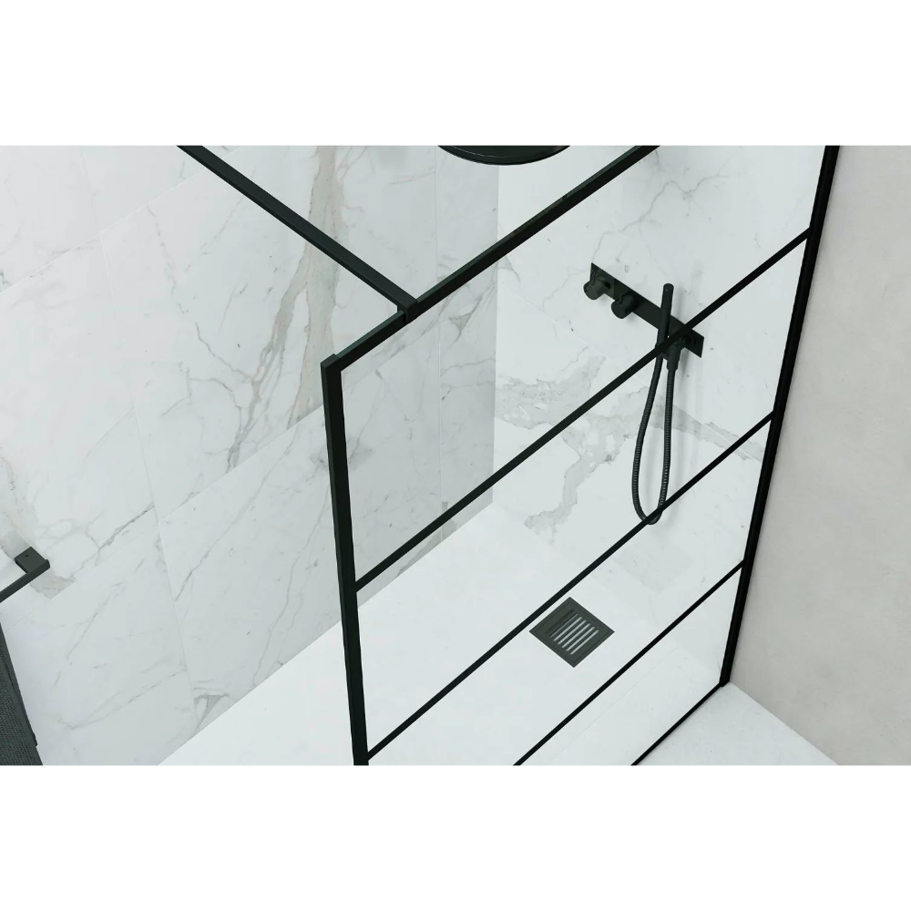 Modern marble wetroom with Flair AYO 8mm black framed glass shower panel, matte black showerhead and rail system, and integrated floor drain against veined white marble tiles