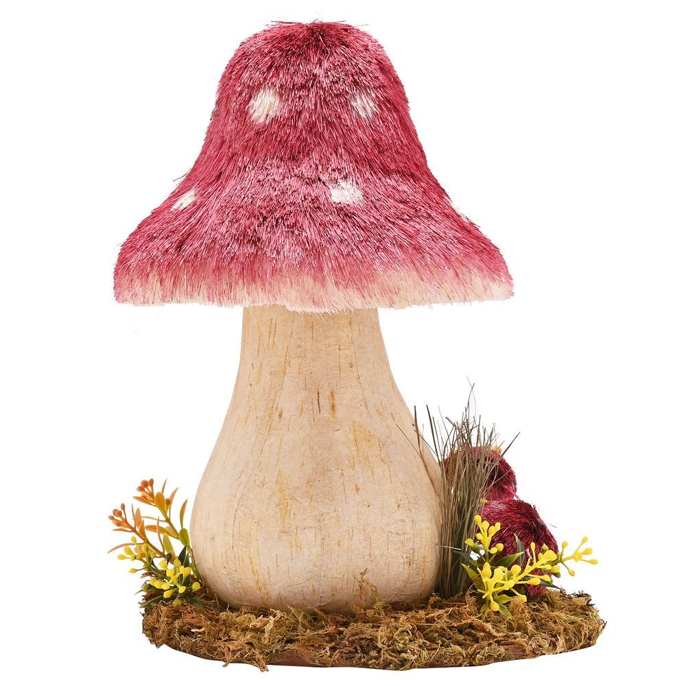 Handmade wooden mushroom ornament with deep red fuzzy cap, pale wooden stem, white spots, surrounded by miniature yellow flowers and moss on brown base