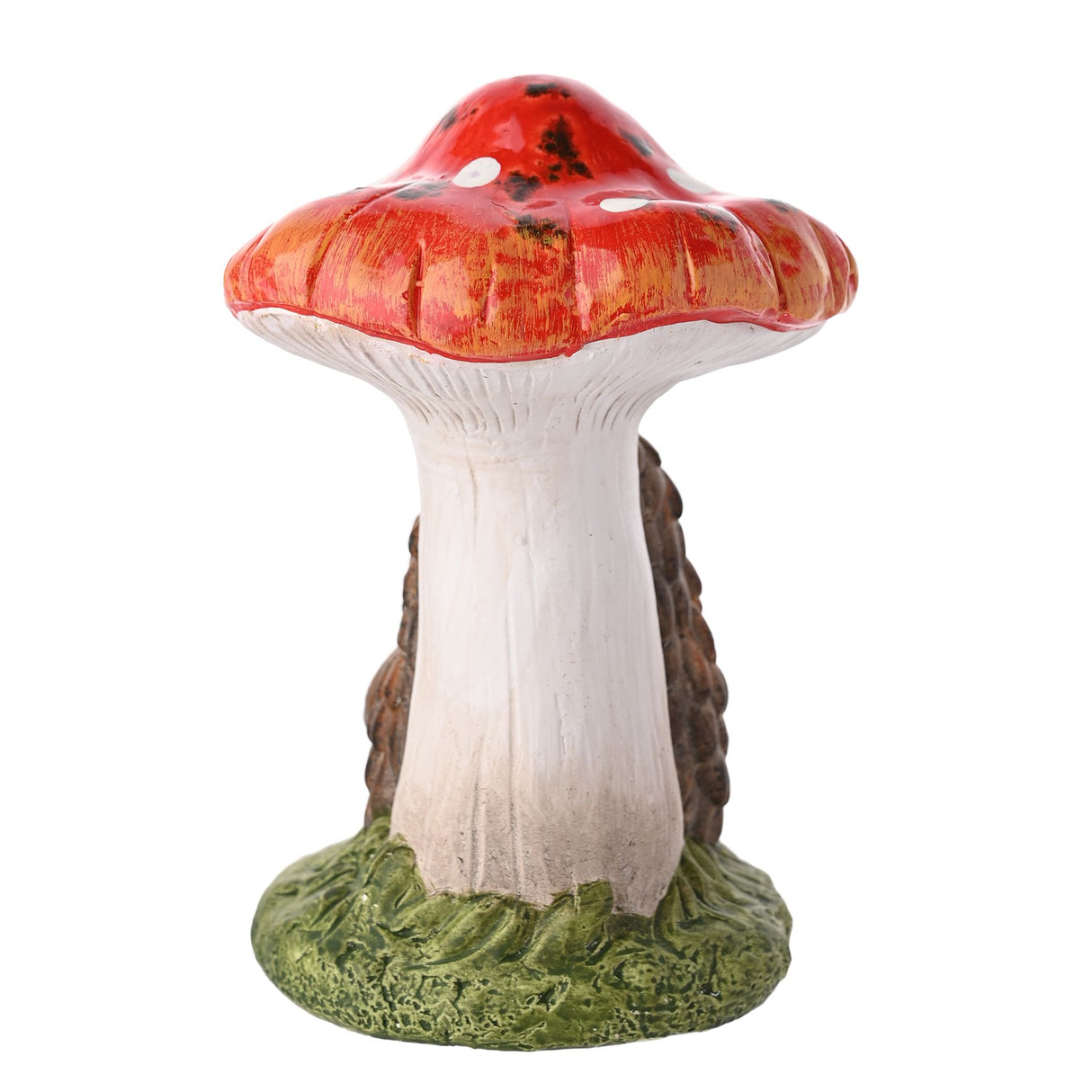 Decorative garden ornament featuring a red and white spotted toadstool mushroom with a hedgehog holding a pinecone against the stem, set on a green moss base, painted ceramic figurine