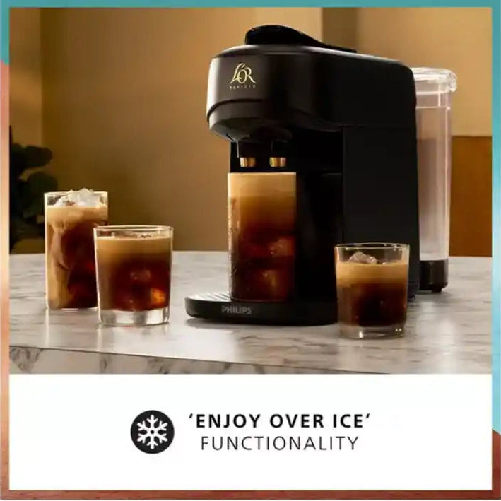 Philips L'OR Barista Absolu black coffee machine with water reservoir dispensing iced coffee into three glasses on marble counter, demonstrating enjoy over ice functionality