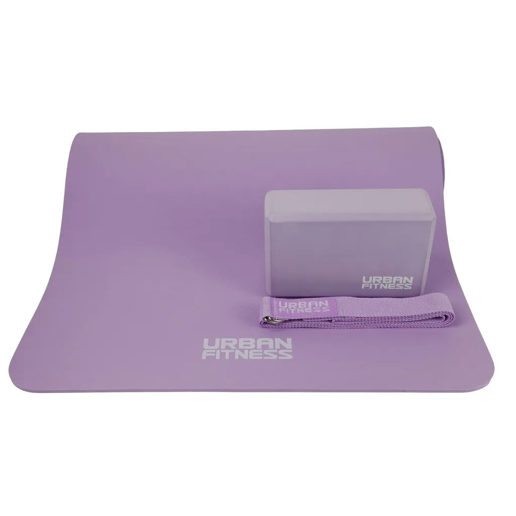 Purple Urban Fitness yoga kit set including rolled yoga mat, foam block and stretch strap on white background