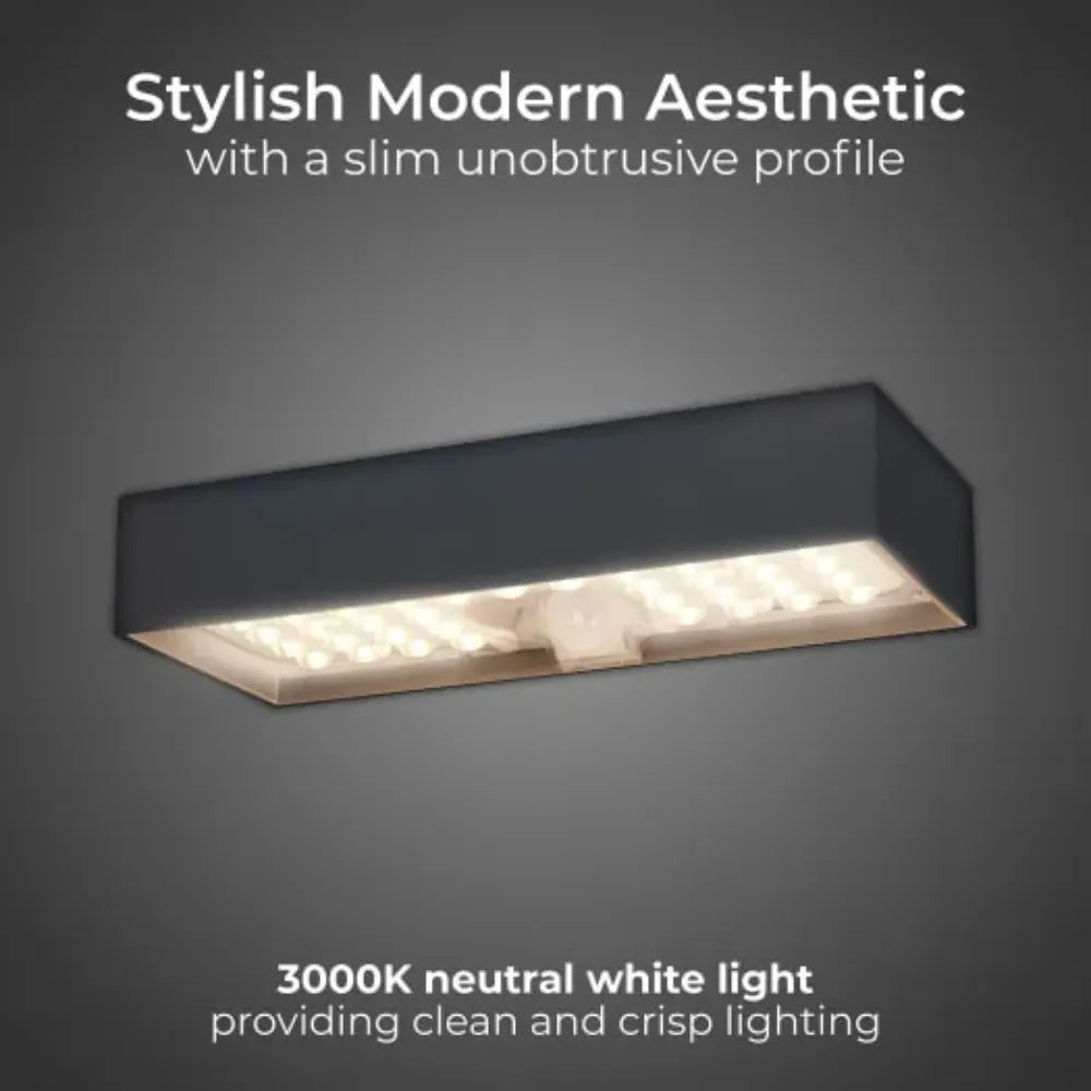 Stylish modern black rectangular ceiling light fixture with slim profile and integrated LED panel emitting neutral white 3000K light against grey background