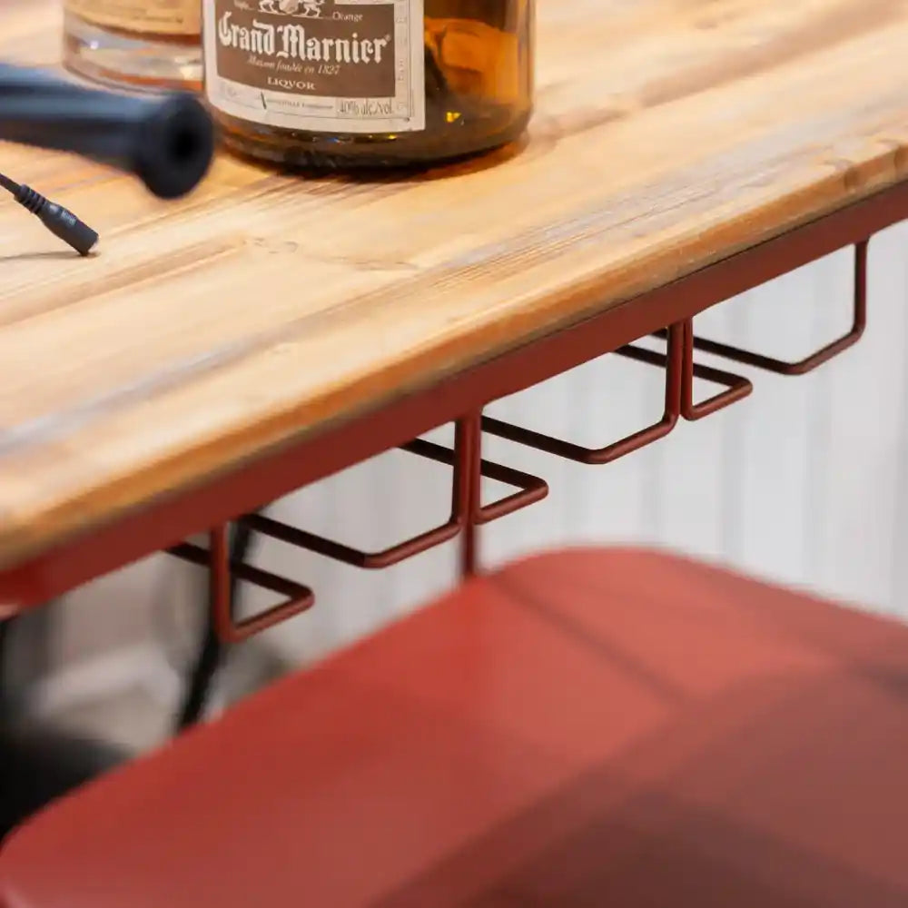 Red metal Vespa scooter-shaped wine rack with natural wood top holding Grand Marnier bottle, featuring curved tubular frame design and multiple bottle holders