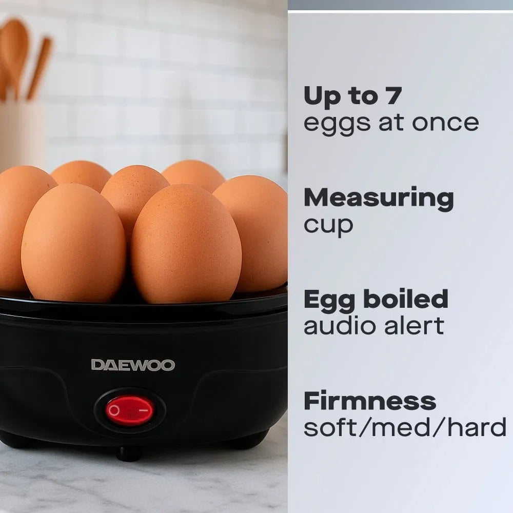 Daewoo black electric egg cooker with seven brown eggs inside, featuring a red power button, measuring cup, and audio alert function for soft, medium and hard boiled eggs