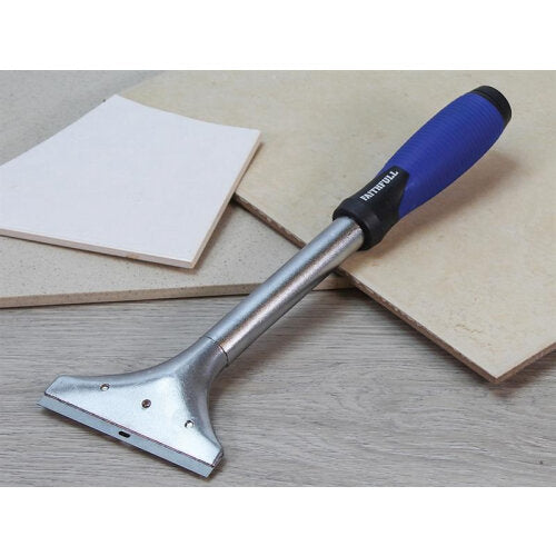 Faithfull Heavy Duty Long Handled Scraper 150mm with blue and black ergonomic handle and metal blade displayed on wooden surface next to white tiles