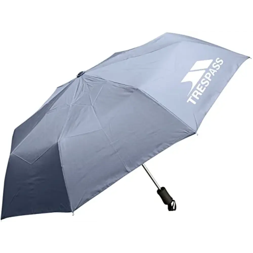 Trespass Compact Umbrella in black with white logo, featuring automatic open mechanism and ergonomic handle, displayed against white background