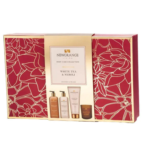 Newgrange Living White Tea and Neroli Body Care Collection 4-piece gift set in red and gold packaging featuring body wash, lotion, body cream and scented candle