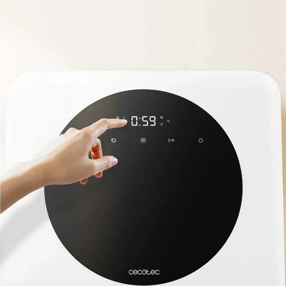 Hand pointing at digital display showing 0:59 on a white Cecotec Bolero Aguazero compact dishwasher with black circular control panel featuring touch controls and LED time display