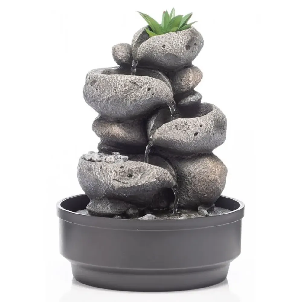 Stacked stone water fountain with cascading tiers, green succulent plant on top, gray ceramic basin base, USB-powered indoor tabletop fountain with flowing water feature