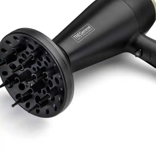 Black TRESemmé Salon Professional 2200W hairdryer with attached black diffuser attachment shown against white background