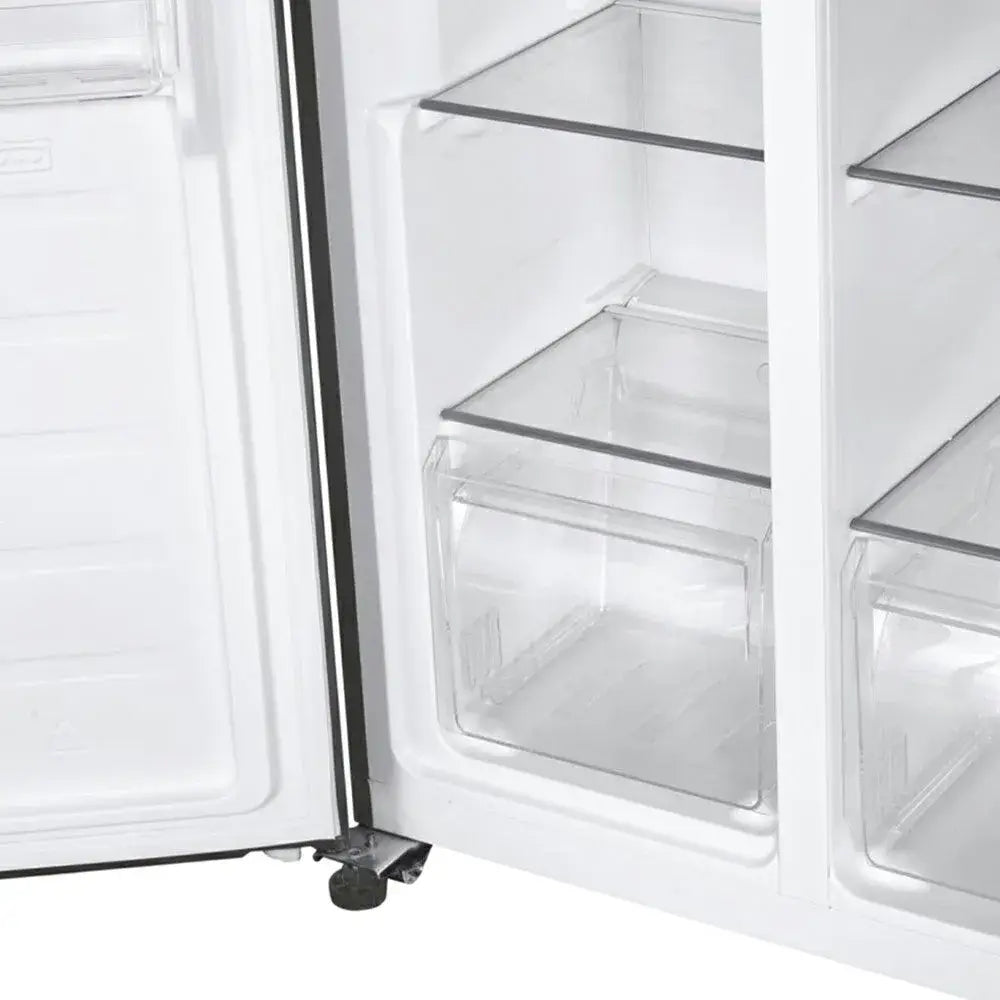 Interior view of a Candy American fridge freezer with open door showing empty glass shelves and clear storage drawers in stainless steel finish