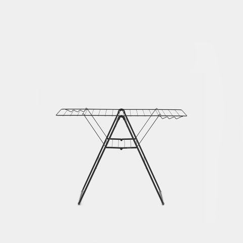 Black metal winged clothes airer with extended horizontal drying bars and folding tripod legs, front view against white background