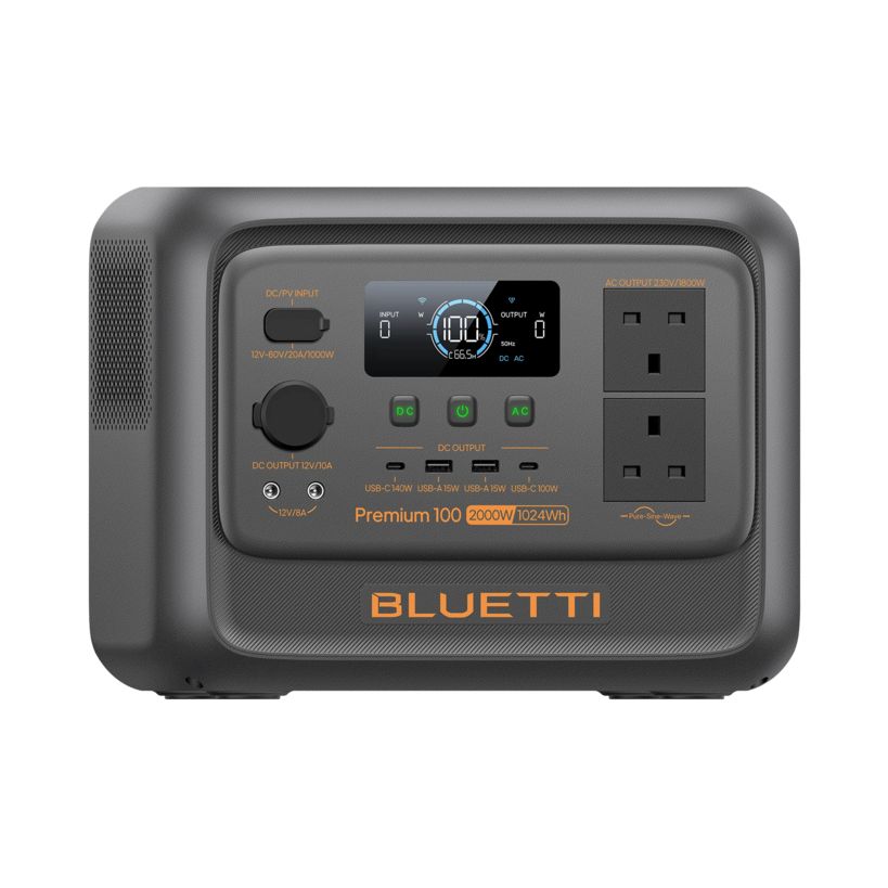 Bluetti Premium 100 V2 portable power station with 2000W output and 1024Wh capacity, featuring dark gray casing with orange accents, digital display showing 100W output, control buttons, dual AC outlets, and multiple USB ports for charging devices