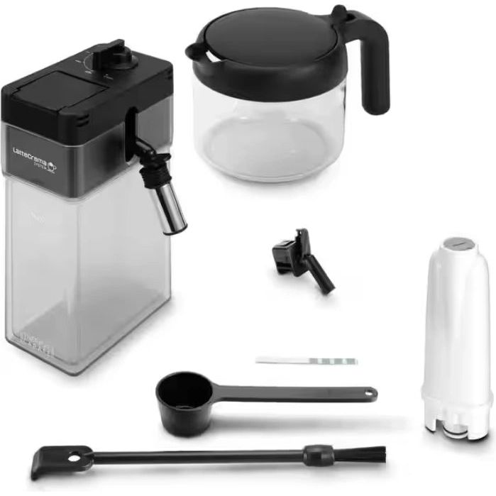 DeLonghi PrimaDonna Soul automatic coffee machine with metal black finish showing complete accessory set including glass carafe with black lid, milk frother, measuring scoop, cleaning brush and water filter on white background