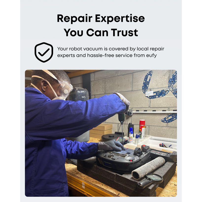 eufy local repair service technician repairing a robot vacuum on a workbench