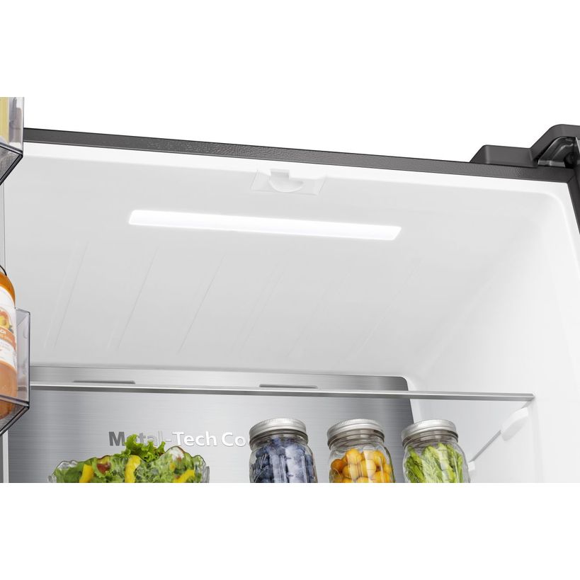 Hisense PureFlat American Style Smart Fridge Freezer in stainless steel showing open refrigerator shelf with fresh vegetables in crisper drawer and glass storage jars containing preserved items and water