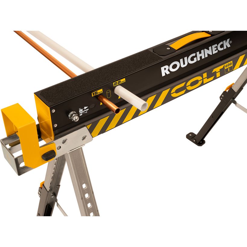 Roughneck Colt 600 folding sawhorse twin pack with yellow and black metal frame, featuring a gray aluminum base stand, work surface with wooden supports, and integrated tool holder