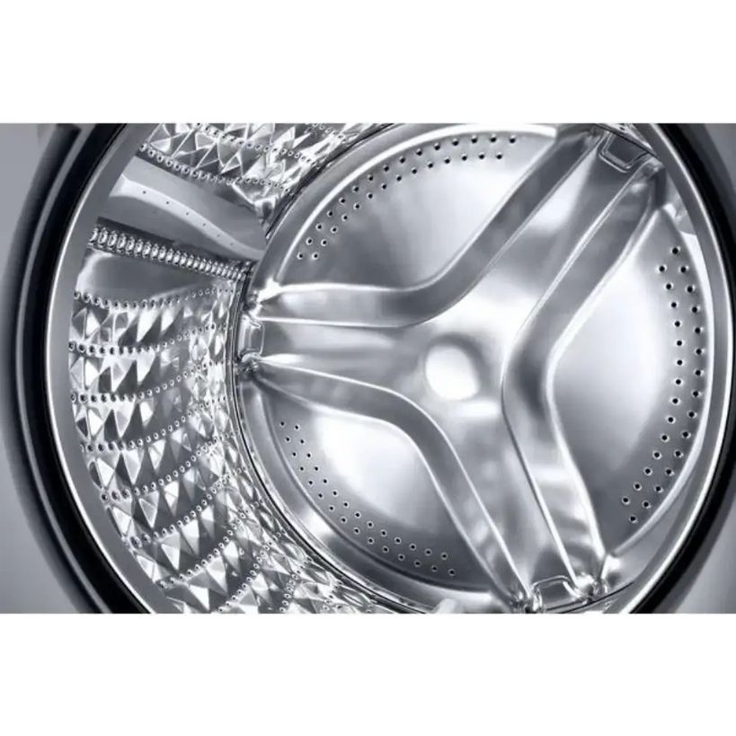 Close-up interior view of Samsung Series 6 washing machine drum showing stainless steel perforated basket with distinctive three-blade impeller design and textured wash surfaces