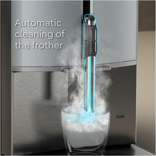 Siemens EQ300 fully automatic bean to cup coffee machine in black and stainless steel with automatic frother cleaning feature, dispensing milk foam into a white cup