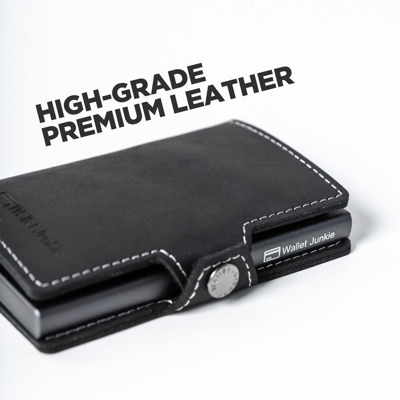 High-grade premium black leather slim wallet with white contrast stitching and metal snap closure, branded Wallet Junkie, displayed against white background