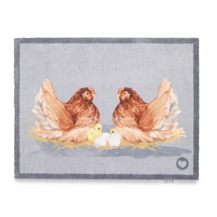 Hug Rug doormat featuring two brown hens with yellow chicks and white eggs on a grey background with grey border, 65cm x 85cm size