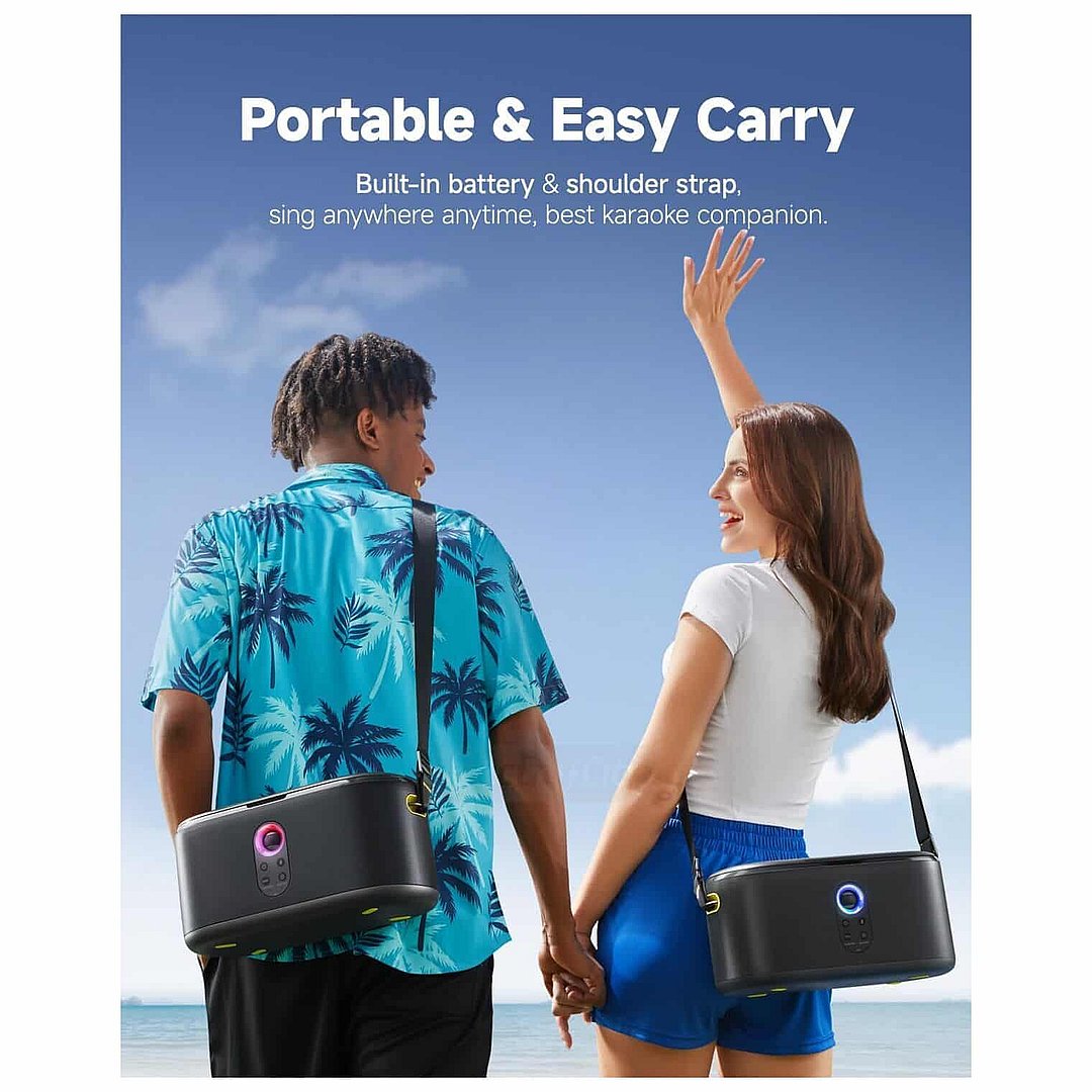 Two people at a beach holding Ikarao Shell S1 portable karaoke machines with shoulder straps, featuring black bodies with illuminated control buttons, against a bright blue sky and ocean background