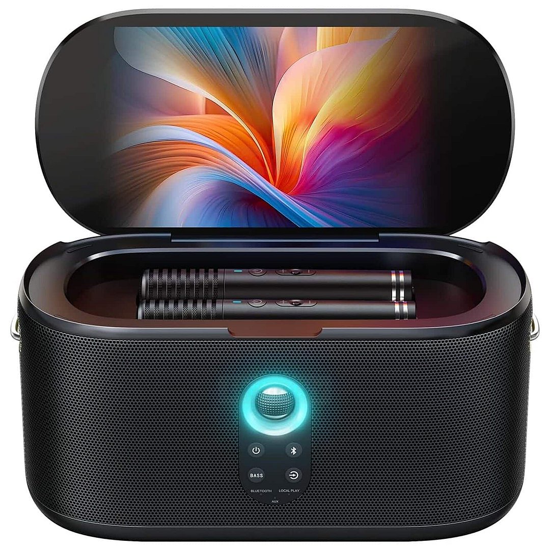 Black mesh portable karaoke machine with 10.1 inch HD display showing colorful abstract wallpaper, dual microphones in case, illuminated turquoise power button, and control panel with bass, Bluetooth and local play options