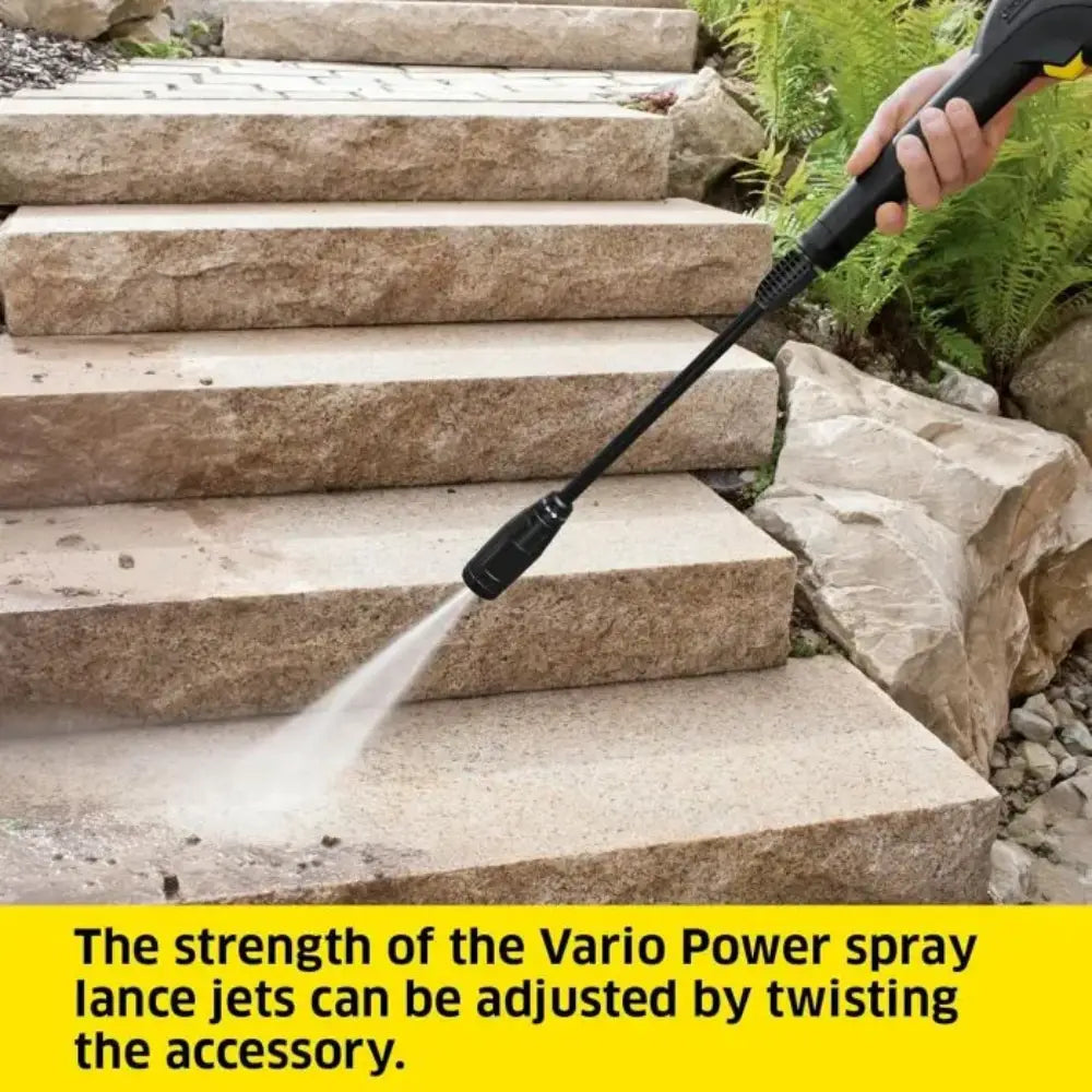 Person using a pressure washer on stone steps with text about Vario Power spray lance.