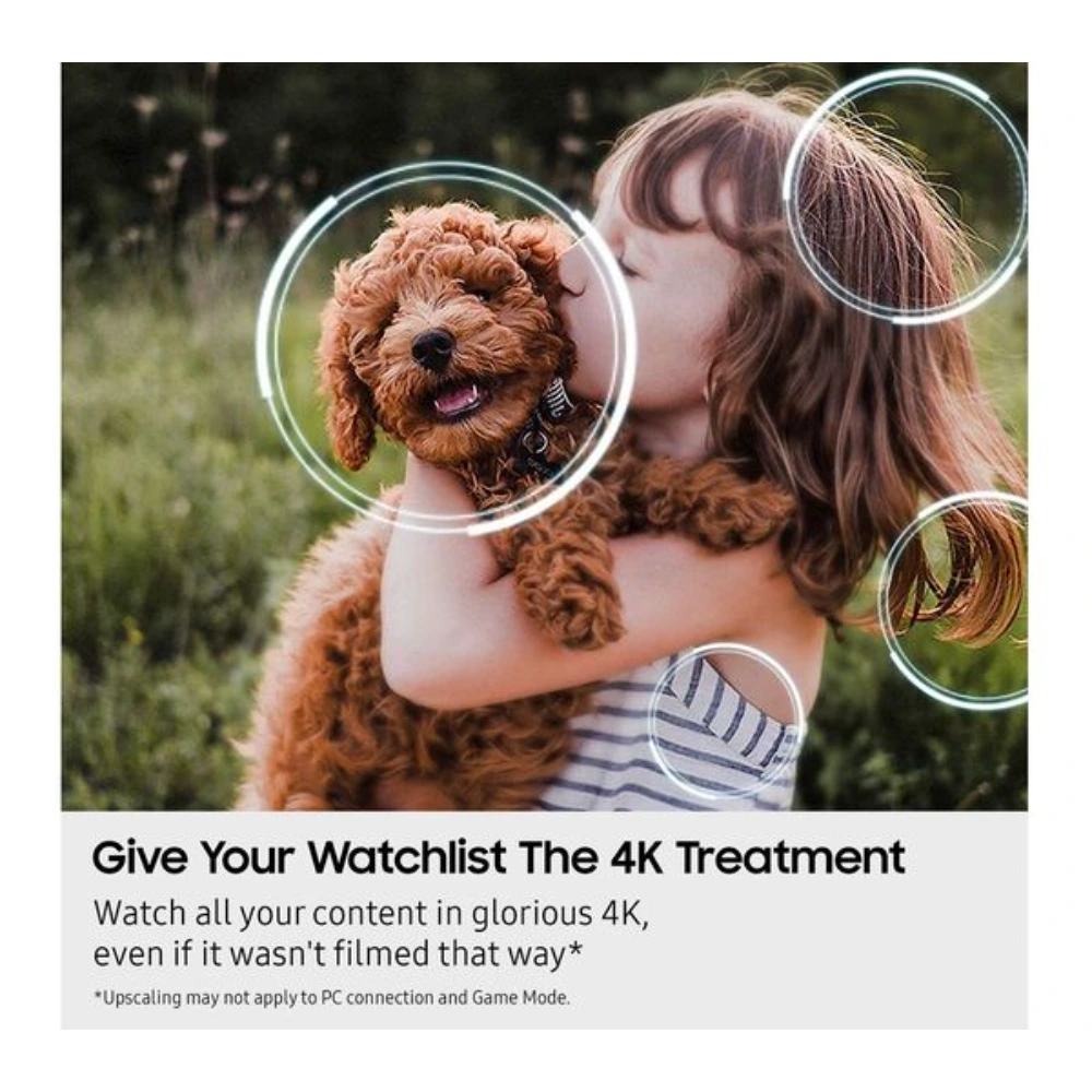 Young girl holding a brown fluffy puppy outdoors with circular magnification overlays demonstrating 4K upscaling technology, advertising Samsung OLED TV with text "Give Your Watchlist The 4K Treatment"