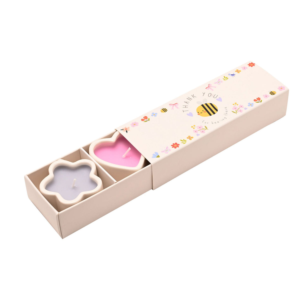 Three decorative mini candles in flower-shaped holders displayed in a cream cardboard gift box with "Thank You" and bee design printed on the sleeve, featuring pink and lavender colored candles