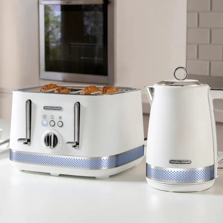 Morphy Richards Illumination white 4-slice toaster with blue dotted band detail, displaying golden toasted bread, paired with matching white electric kettle on kitchen countertop