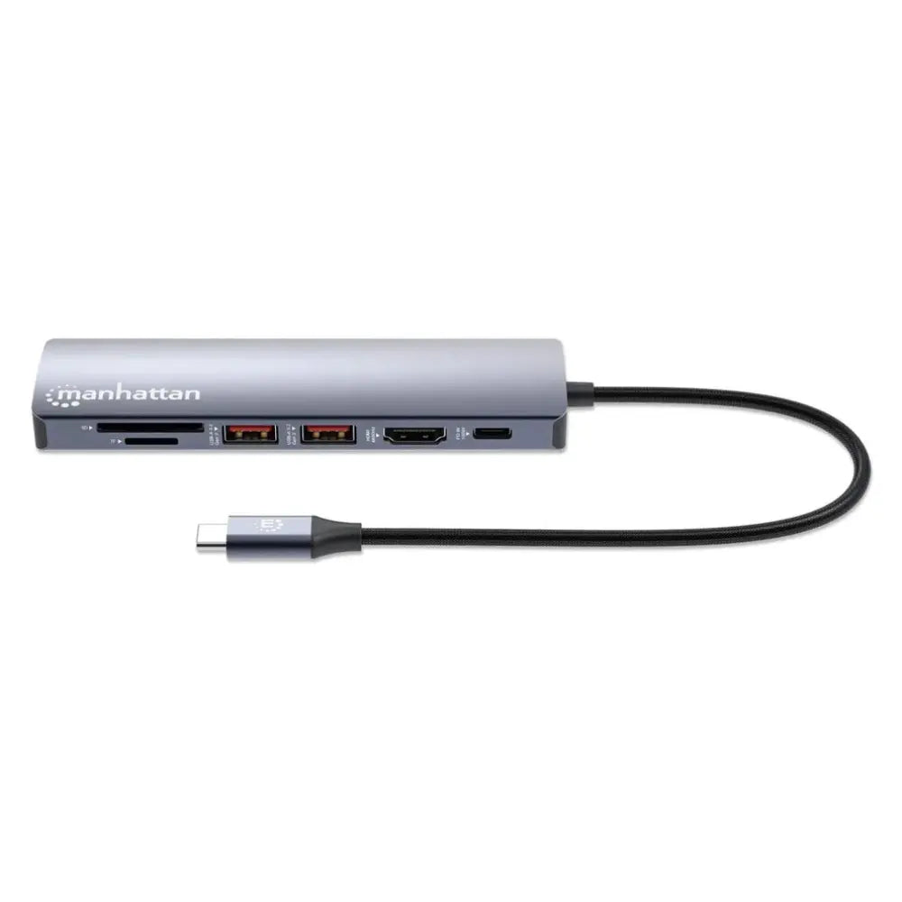 Manhattan USB-C 7-in-1 docking station with gray aluminum body, featuring SD card reader, dual USB ports, HDMI and USB-C ports, connected via black braided USB-C cable