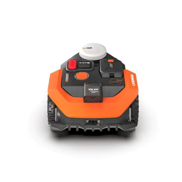 Top-down view of Worx Landroid Vision AI RTK orange and black robotic lawnmower with white GPS module on top, control panel with red emergency stop button, and tracked wheels for lawn mowing up to 500m2