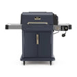 Ninja FlexFlame PG301UKBL gas barbecue grill in dark blue with stainless steel control panel displaying 260 temperature setting, featuring side shelves, front cart with wheels, and gold handles