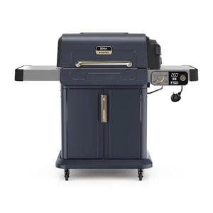 Ninja FlexFlame PG301UKBL gas barbecue grill in dark blue with stainless steel control panel displaying 260 temperature setting, featuring side shelves, front cart with wheels, and gold handles