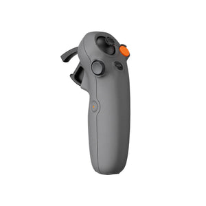 DJI Avata 2 FPV drone remote controller in gray with orange accent buttons, featuring dual grip handles and control sticks for first-person view flying