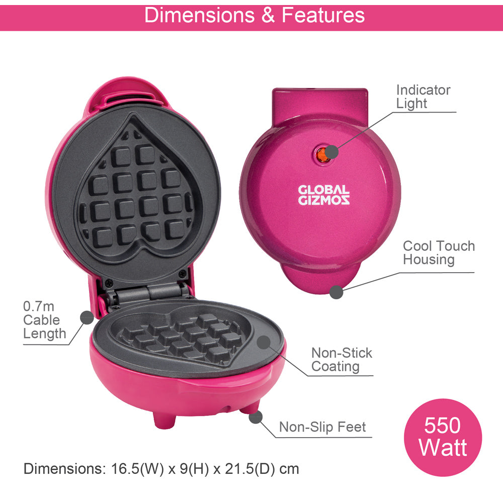 Global Gizmos pink heart-shaped waffle maker showing front and top views with labeled features including 0.7m cable, indicator light, cool touch housing, non-stick coating, non-slip feet, and 550 watt power rating, dimensions 16.5W x 9H x 21.5D cm