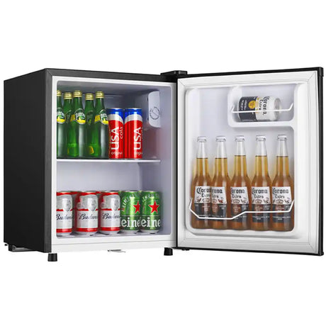 Black tabletop beverage cooler with glass door open displaying shelves stocked with green beer bottles, red and white cans, and Corona beer bottles on the right side door shelf