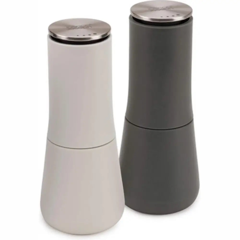 Joseph Joseph Milltop salt and pepper mill set in cream and charcoal with stainless steel tops featuring modern tapered design