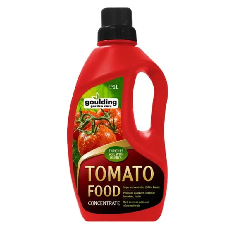 Red plastic bottle of Goulding tomato food concentrate fertilizer with black cap, featuring images of ripe tomatoes and green foliage on the label, 1.5 litre size with humics enriched soil formula